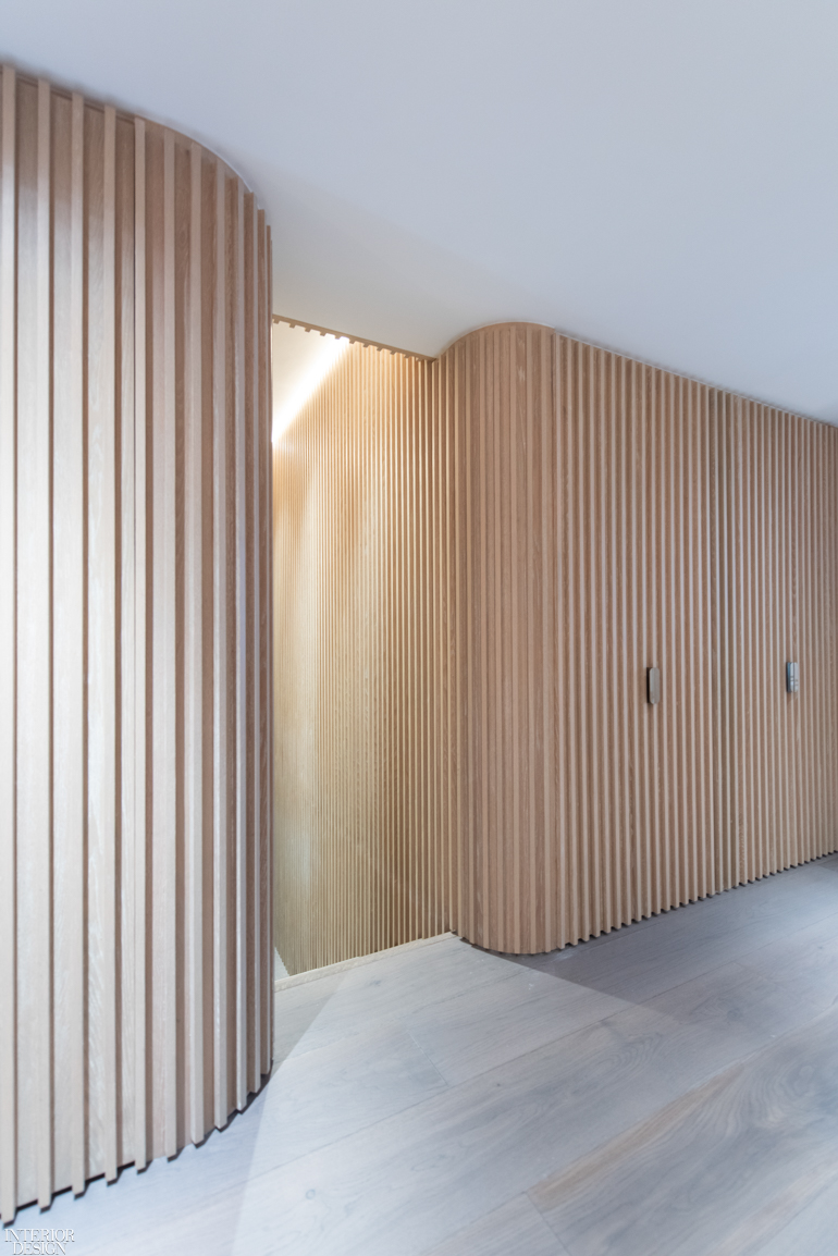 a timber-slat hallway makes add dramatic flair to a home