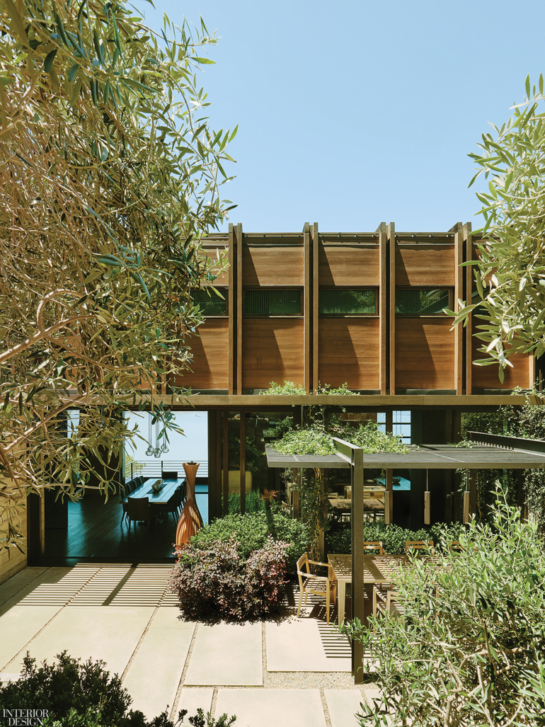 A home with an expansive patio surrounded by trees