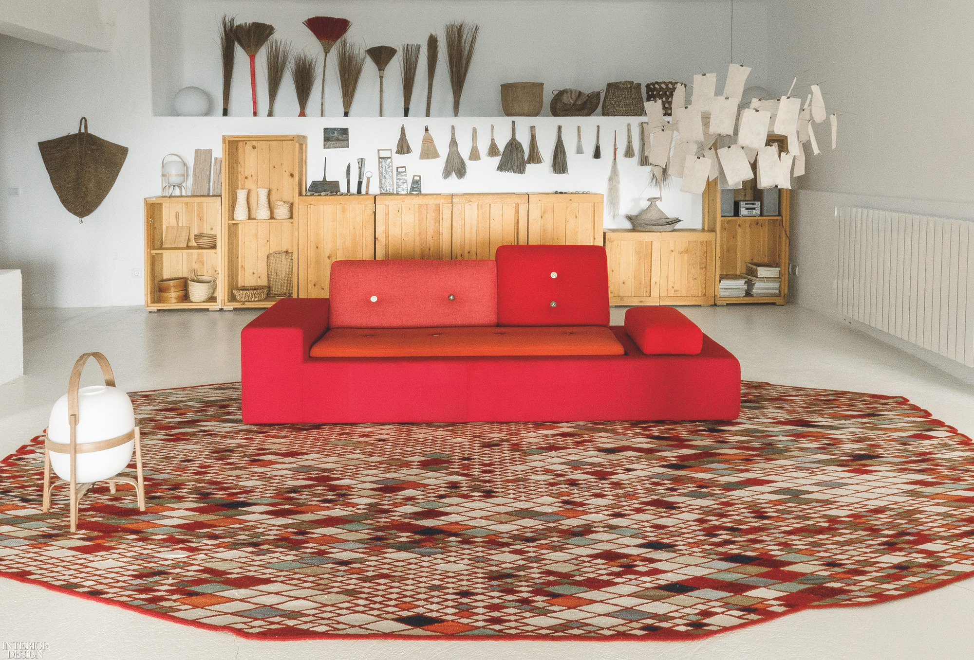 A red geometric couch in a modern country house