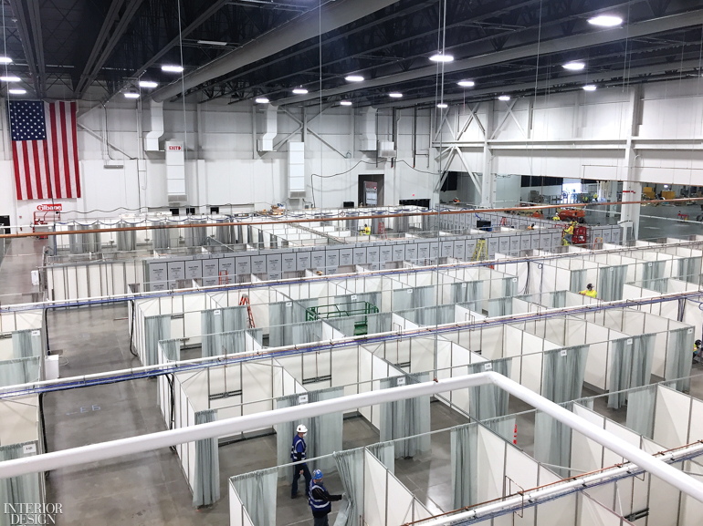 White curtains offer privacy rooms for patients in an emergency field hospital.