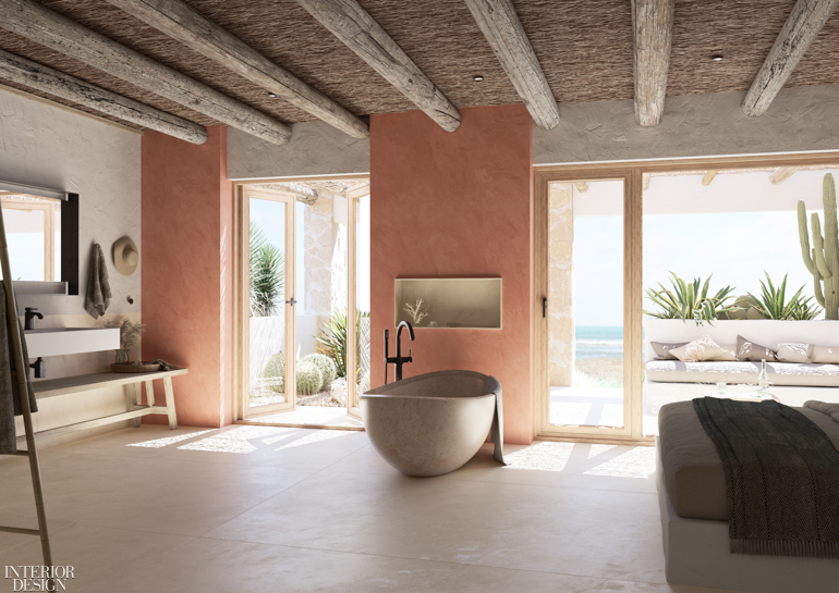 A standing tub in an airy bathroom that opens to an outdoor patio with ocean views