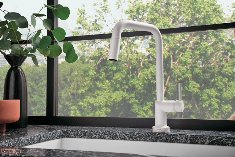 a white faucet against a dark marble countertop