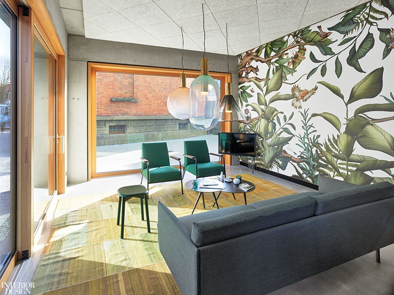 Botanic wallcoverings evoke the nearby forests in this hotel lobby. 