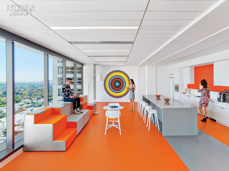 a colorful circle that looks like a target at the end of a bright orange office kitchen